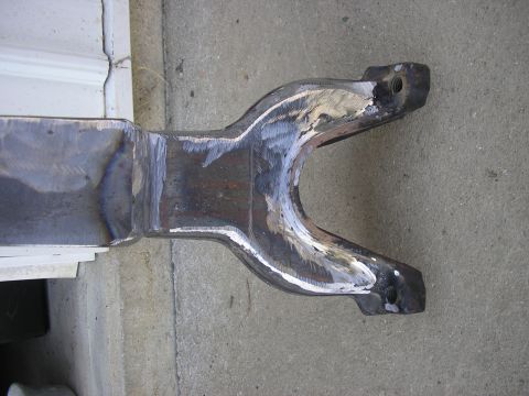 1996 Ford Bronco - A close-up view of a modified metal part, likely from a vehicle's suspension system.
