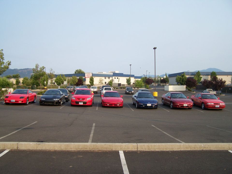 A row of cars parked in a lot.