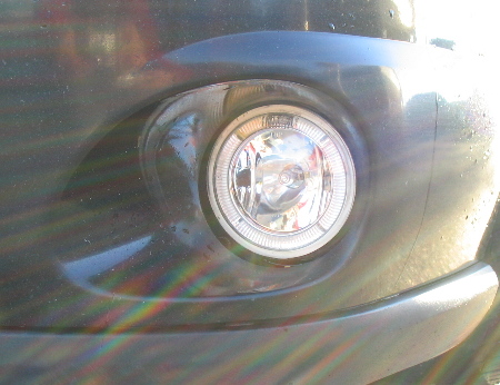 2003 Ford Focus — Hella Optilux fog light, close up.