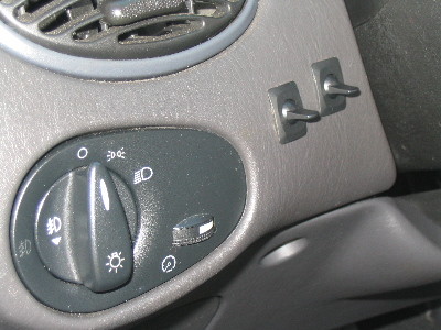 2003 Ford Focus — The switches i installed for the fog lights. Left one turns on the halos, right one turns on the fogs (they'r…