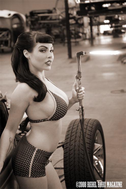 Woman in a bikini on a unicycle, holding the handlebars