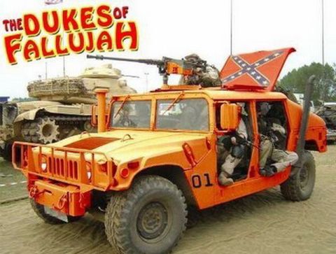 1991 Ford Crown Victoria - An orange Humvee, marked with "01" and flying a Confederate flag, is positioned near a military tank.