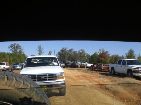 1989 Ford Bronco - White Ford F-Series truck, likely early 90s model, parked with other vehicles at an outdoor event.