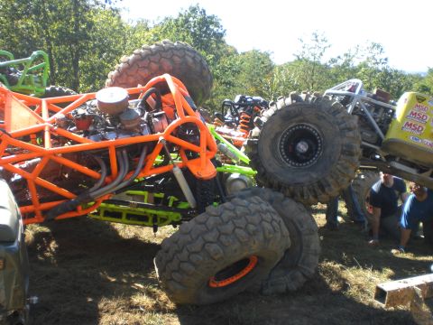 1989 Ford Bronco - Multiple custom off-road buggies are shown in an outdoor setting with trees in the background.