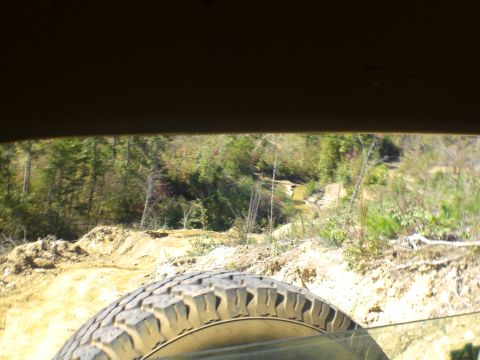 1989 Ford Bronco - View from inside a vehicle looking out at an off-road trail.