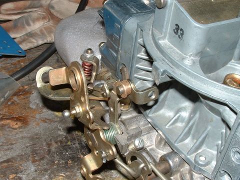 1978 Ford Ranchero - Carburetor linkage detail, showing springs and levers on a metal part.