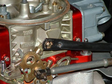 1978 Ford Ranchero - This is a close-up view of a Holley carburetor, showing its intricate mechanical components and red accents.
