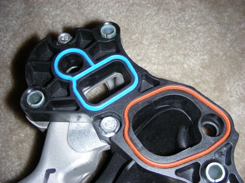 1998 Mercury Grand Marquis - Intake manifold gasket set with blue and orange seals, ready for installation.