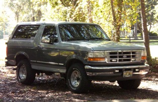 1996 Ford Bronco - This gray Ford Bronco from the 1992-1996 model years is shown from the front three-quarter angle.