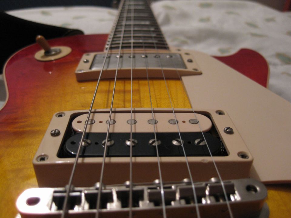 close-up of electric guitar pickups and strings