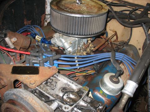 1978 Ford F-250 - The engine bay features a carburetor and air filter, with blue spark plug wires running across the frame.