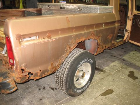 1978 Ford F-250 - This heavily rusted 1973 Ford F-250 pickup truck shows significant body damage and decay.