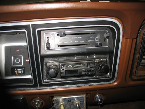 1978 Ford F-250 - The interior of a 1978 Ford F-250 shows the dashboard with a JVC radio and climate controls.