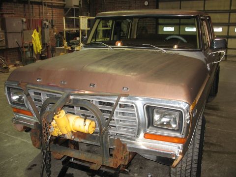 1978 Ford F-250 - Front view of a brown 1978 Ford F-250 pickup truck with a winch attached to its brush guard.