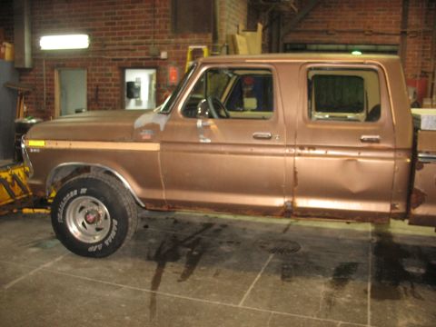 1978 Ford F-250 - Side view of a brown 1978 Ford F-250 crew cab pickup truck with visible rust and damage.