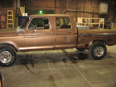 1978 Ford F-250 - This pickup truck has significant rust damage on its body panels and wheel wells.