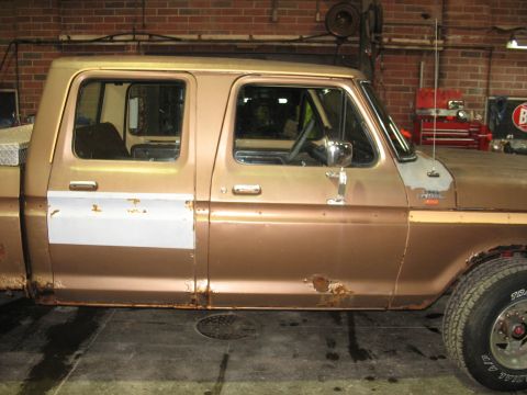 1978 Ford F-250 - This pickup truck shows significant rust damage along the rocker panels and lower doors, with a mismatched patch on the front door.