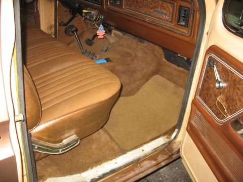 1978 Ford F-250 - Interior view of a 1978 Ford F-250, showing the driver's side seat, floor, and dashboard details.