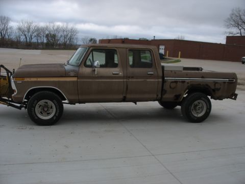 1978 Ford F-250 - This four-door pickup truck is equipped with a front-mounted plow, suggesting it's used for snow removal.