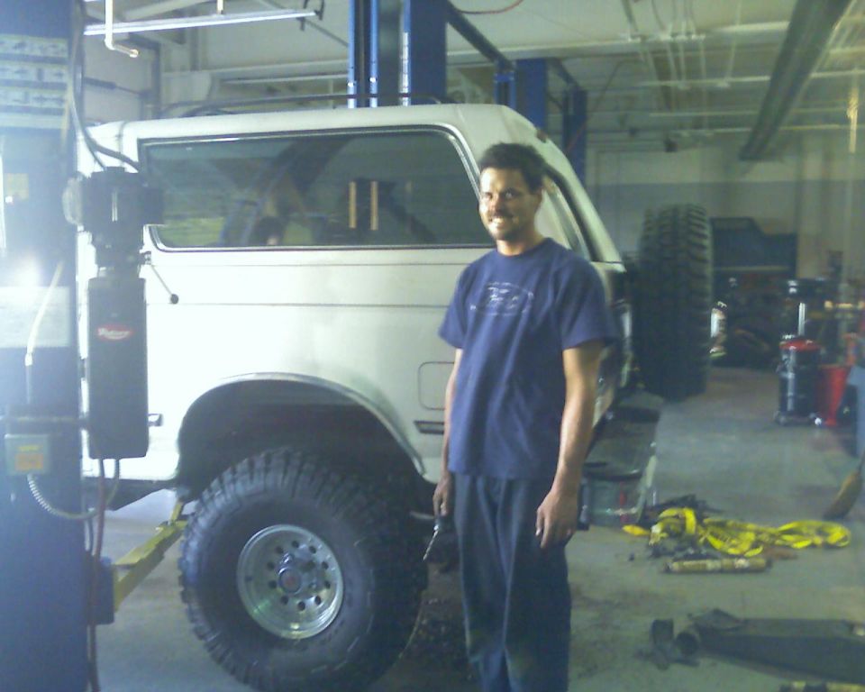 White 1992 Ford Bronco side view in garage