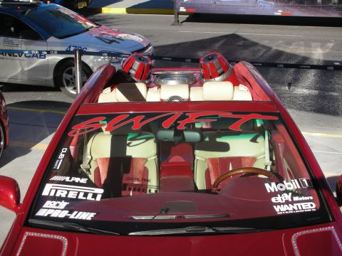 1998 Ford Crown Victoria - This custom convertible features a unique interior and prominent audio equipment, with another vehicle visible in the background.