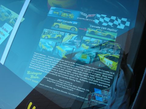 1998 Ford Crown Victoria - Display board describing a streetable Corvette C6R replica project by Bistagne Bros Body Shop with sponsor logos.