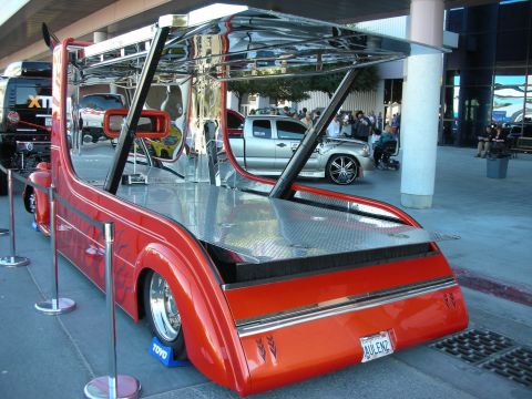 1998 Ford Crown Victoria - Custom tow truck with a unique design, parked outdoors with other vehicles nearby.