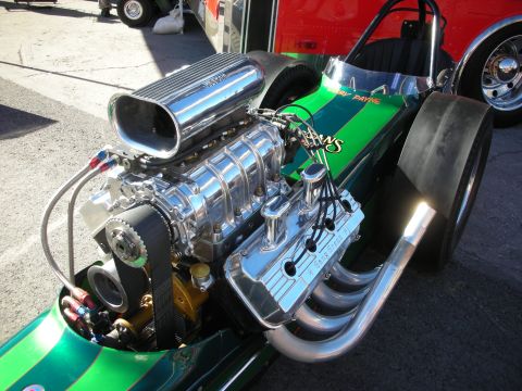 1998 Ford Crown Victoria - A powerful dragster engine, a polished supercharger and custom exhaust, is displayed prominently.