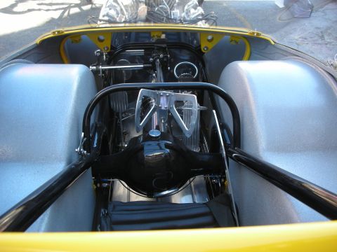 1998 Ford Crown Victoria - Customized rear suspension and axle assembly visible in a yellow vehicle's interior.