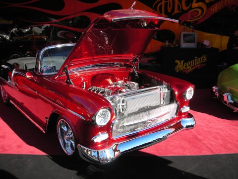 1998 Ford Crown Victoria - Customized 1955 Chevrolet convertible on display with its hood open, revealing the engine.