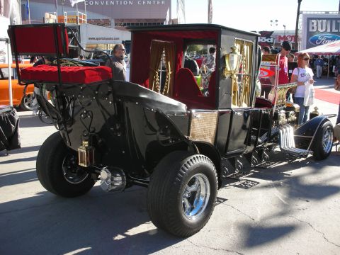 1998 Ford Crown Victoria - A custom-built carriage car with a unique design and elaborate interior is on display.