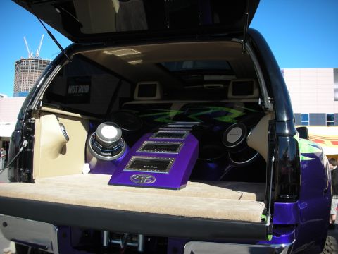1998 Ford Crown Victoria - The rear interior of a car is heavily modified with custom audio equipment.