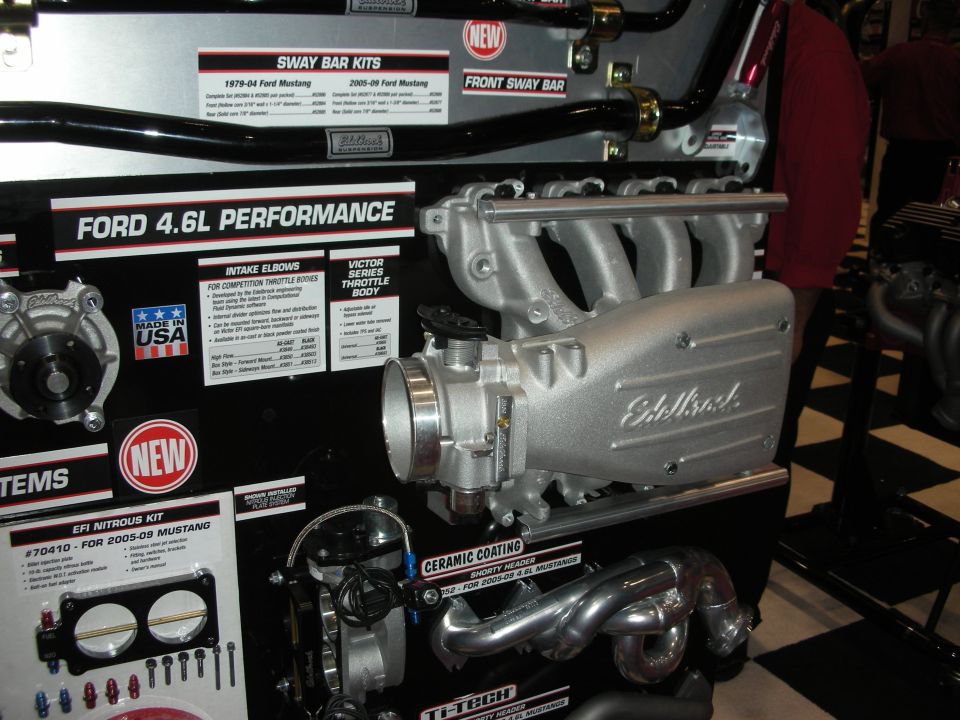 Ford 4.6L performance parts display with Edelbrock intake and throttle body