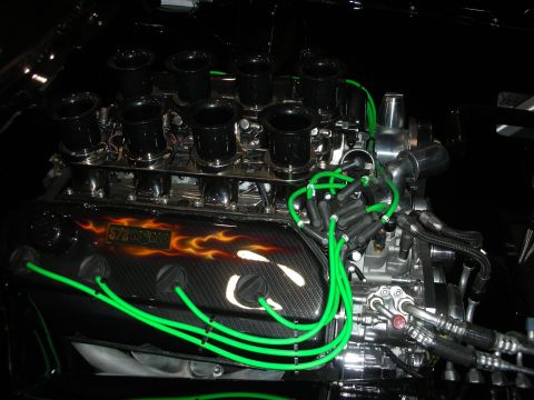 1998 Ford Crown Victoria - Close-up of a custom engine a "572" decal and flame graphics on the valve cover.