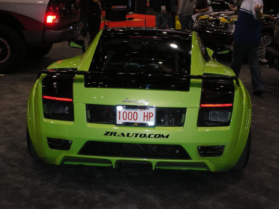 Lime green sports car rear with '1000 HP' license plate and ZRAUTO.COM text