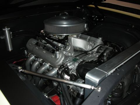 1998 Ford Crown Victoria - Close-up view of a modified V8 engine with custom components and a large air filter.