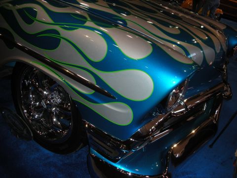 1998 Ford Crown Victoria - Custom flame paint job on a classic car's front end, chrome details.
