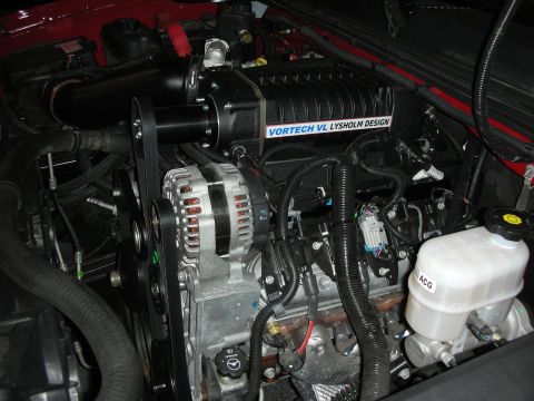 1998 Ford Crown Victoria - Close-up of an engine a Vortech VL Lysholm Design supercharger and alternator.
