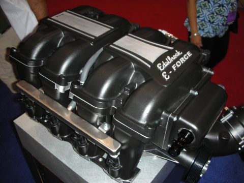 1998 Ford Crown Victoria - A black Edelbrock E-Force supercharger is displayed on a pedestal.