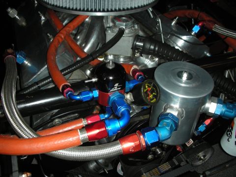 1998 Ford Crown Victoria - Custom engine fuel system components including a fuel pressure regulator and gauge.
