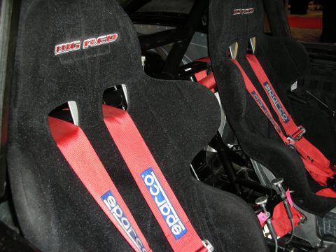 1998 Ford Crown Victoria - Interior view of black racing seats with red Sparco harnesses and "BIG RED" badging.