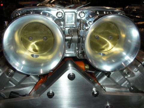 1998 Ford Crown Victoria - Close-up of a polished Accufab dual throttle body, likely a performance upgrade.