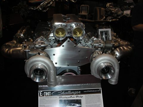 1998 Ford Crown Victoria - Custom twin-turbocharged V8 engine on display with informational placard.