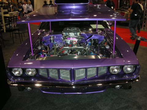 1998 Ford Crown Victoria - Custom purple car with hood open, a modified engine and prominent hood scoop.