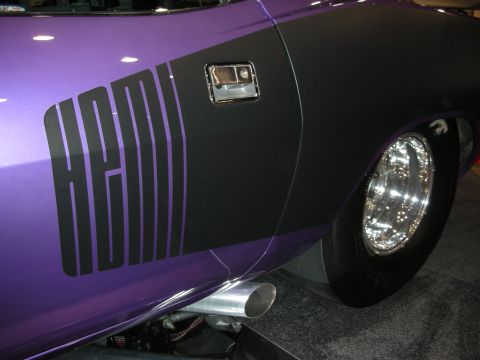 1998 Ford Crown Victoria - Muscle car with HEMI graphics on the side, showing a chrome wheel and exhaust pipe.