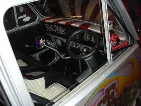1998 Ford Crown Victoria - The interior of a heavily customized car shows a unique dashboard and seating arrangement.