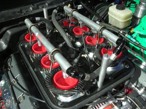 1998 Ford Crown Victoria - Close-up of an engine's fuel rail system, Bosch injectors and a carbon fiber manifold.