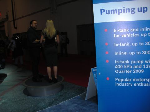 1998 Ford Crown Victoria - A trade show display features information about fuel pumps for vehicles.