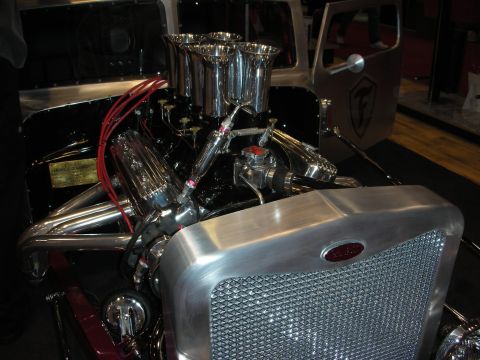 1998 Ford Crown Victoria - Custom hot rod engine bay with polished components and a distinctive grille. The door shows a logo.