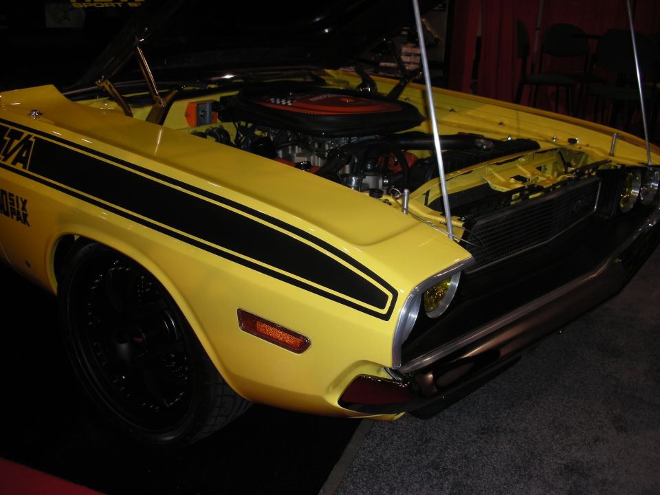 Yellow 1970 Dodge Challenger R/T with black stripes and exposed engine
